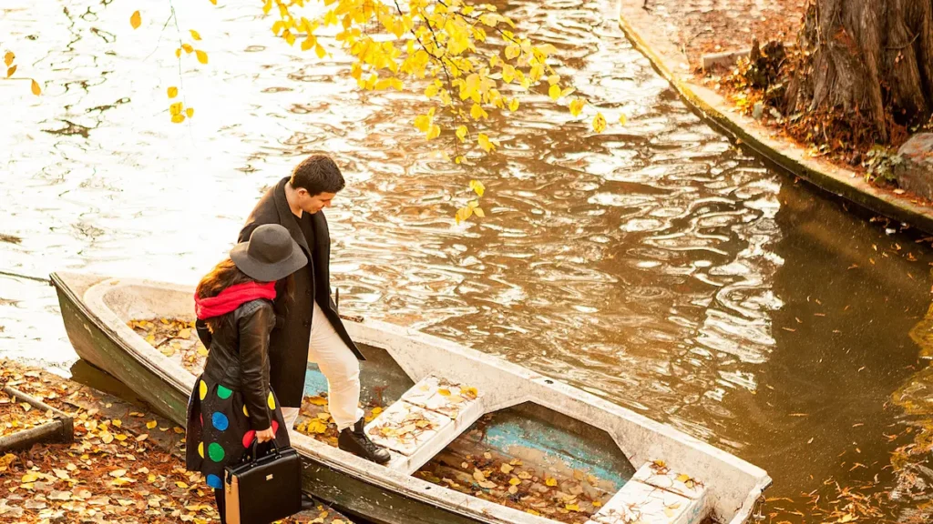 couple next to a boat in park